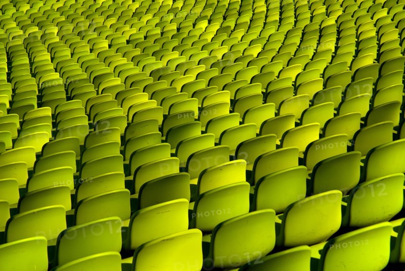 Olympic Stadium. Curved section of bright green seating in the stadium. Photo : Hugh Rooney