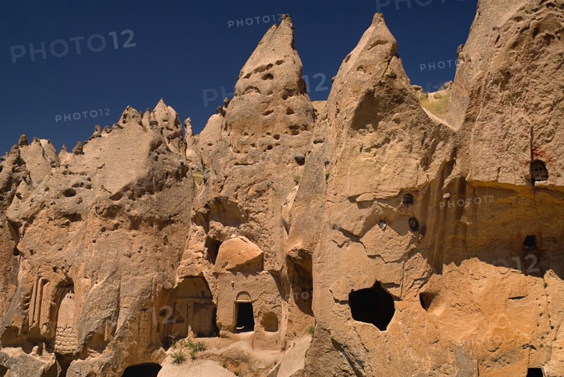 Zelve Open Air Museum. Abandoned monastic cave town inhabited until 1952 when the valley was deemed too dangerous to live in any more. Uzumlu Kilise The Church with Grapes eroded exterior cut from the rock. Photo: Hugh Rooney
