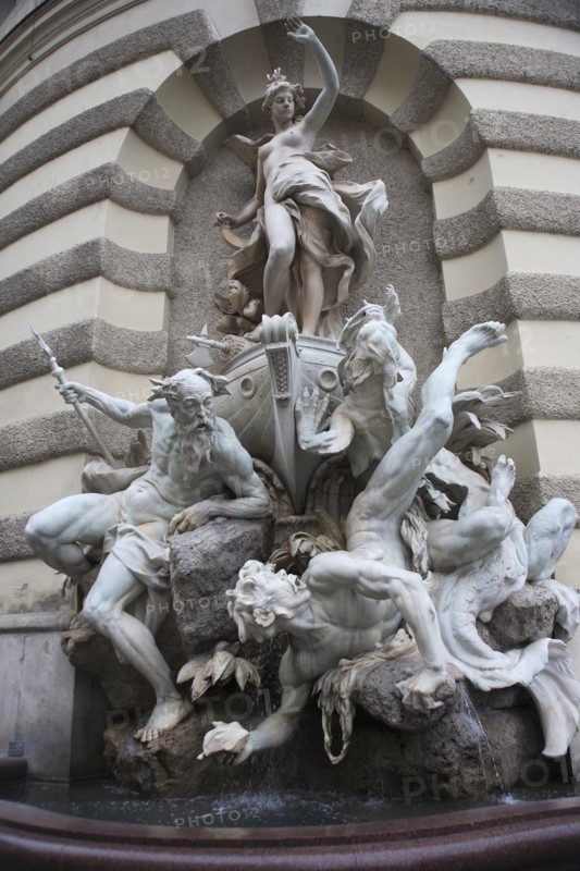 Michaelertrakt the southern gateway into the Hofburg Palace. The statues and figures include Heracles the greatest of the Greek heroes and represent Austrias power over land and sea. Photo: Bennett Dean