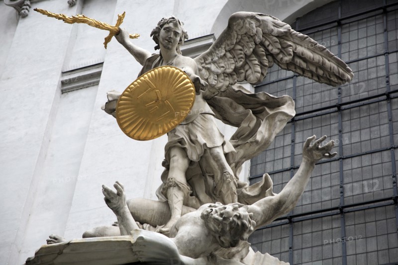 Sculpted figures above the entrance to St Michaels Church depicting St Michael slaying Lucifer by Lorenzo Mattielli. Photo : Bennett Dean