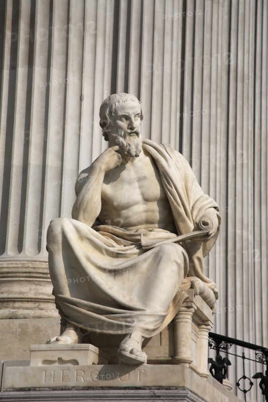 Statue of the Greek philosopher Herodotus in front of columns of the Parliament Building. Photo: Bennett Dean