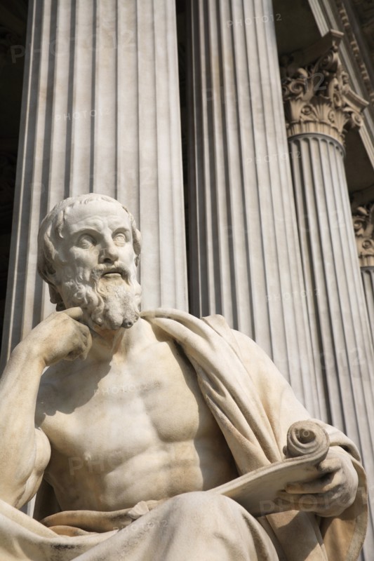 Statue of the Greek philosopher Herodotus in front of columns of the Parliament Building. Photo: Bennett Dean