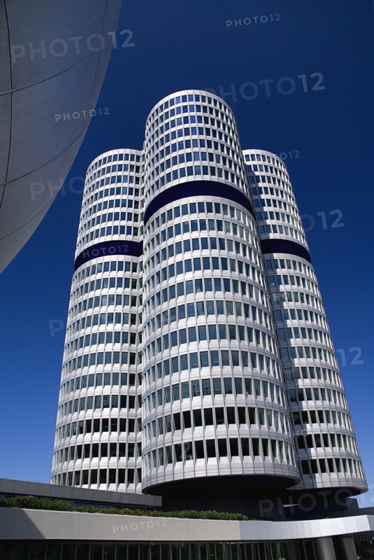 BMW Headquarters exterior with the BMW Tower which stands 101 metres tall and mimics the shape of tyres.. Photo : Hugh Rooney