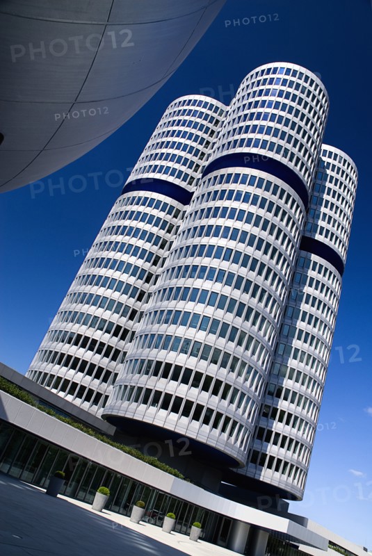 BMW Headquarters exterior. Angled view of the BMW Tower which stands 101 metres tall and mimics the shape of tyres.. Photo: Hugh Rooney