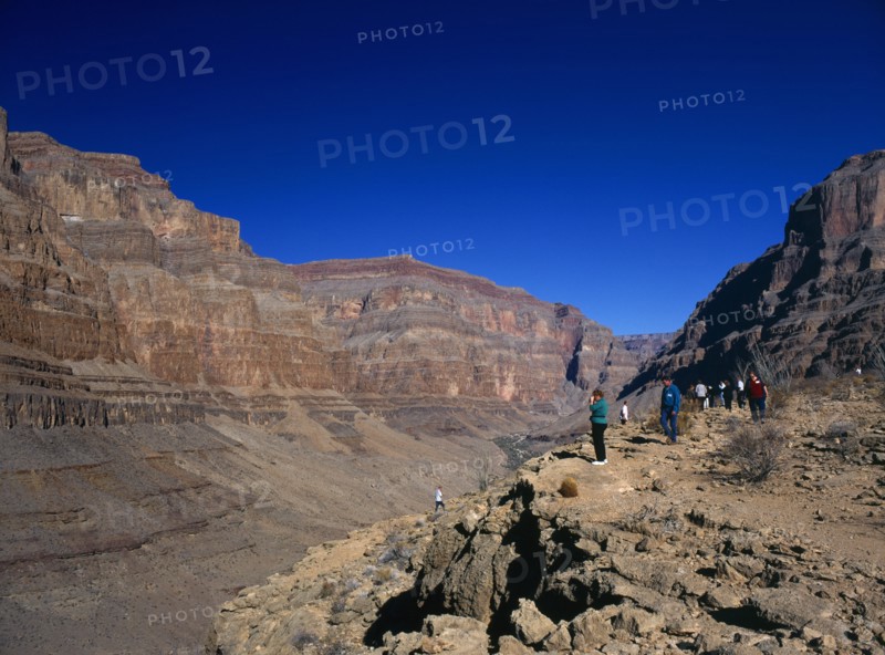 USA, Arizona, Grand Canyon, Tourists looking down onto the colorado river from within the Hualapai Indian reservation part of the canyon national park. 
Photo : Stephen Rafferty