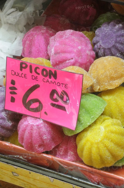 Mexico, Puebla, Markets, Coloured sweets for sale. 
Photo : Nick Bonetti