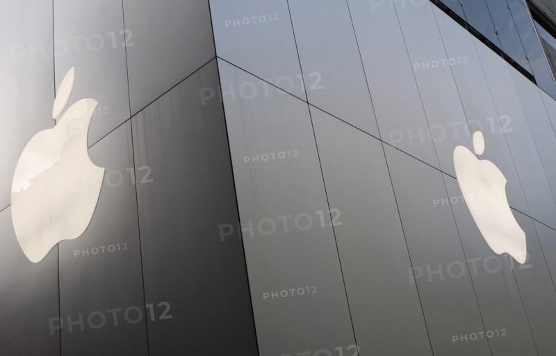 Japan, Honshu, Tokyo, Ginza. Chuo-dori Ave part of the facade of the new Apple Computer store featuring the Apple logo. 
Photo : Jon Burbank