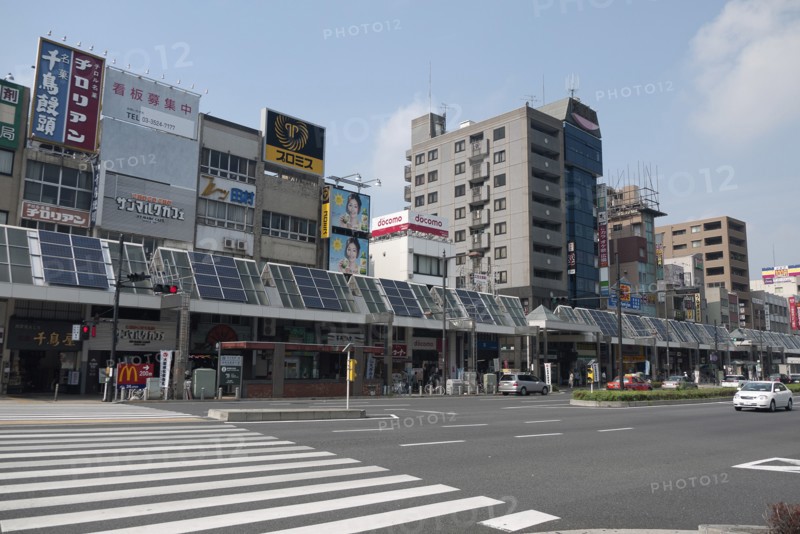 Japan, Honshu, Tokyo, Sugamo. The roof of arcade covering sidewalk used for solar electric and water heating panels. 
Photo : Jon Burbank