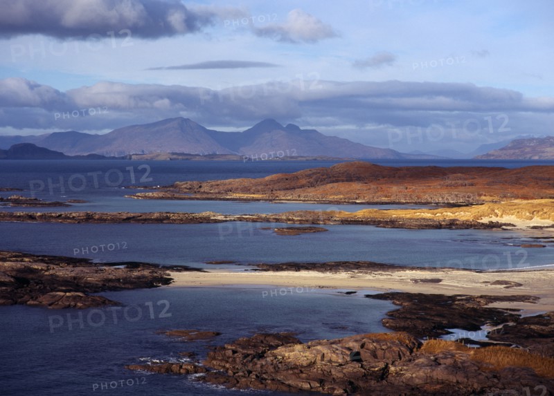 Scotland, Highlands, Ardnamurchan, Sanna Bay with the Isle of Rum beyond. 
Photo : Bryan Pickering
