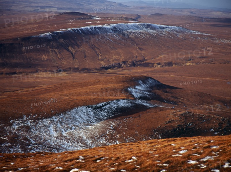 Scotland, Highlands, North, View north west from Ben Griam Mhor Mountain at 590 metres with snow capped ridges facing north east. 
Photo : Bryan Pickering