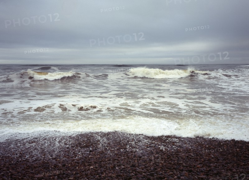 Scotland, Moray, Kingston, North facing shingle beach looking out across rough sea and surf. 
Photo : Bryan Pickering