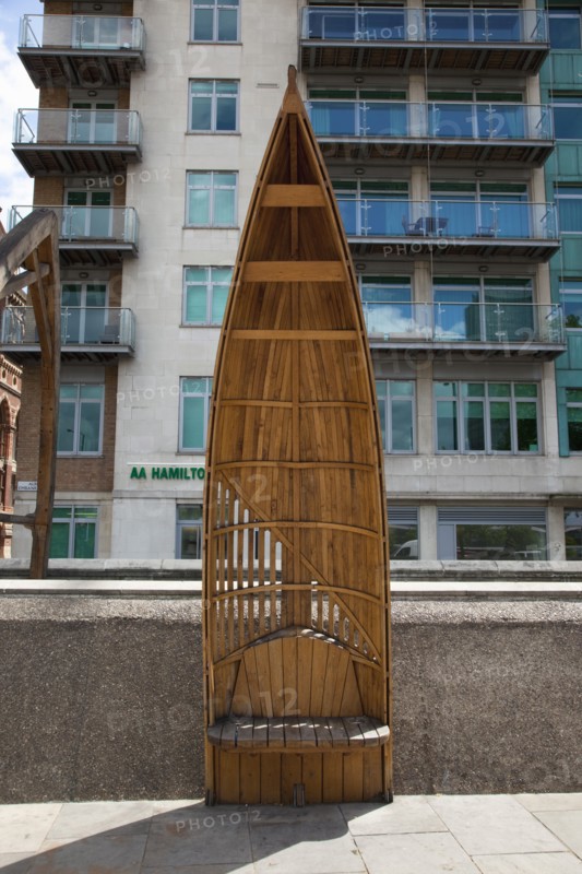 England, London, Vauxhall Albert embankment benches made from wood in the shape of boats. 
Photo : Stephen Rafferty