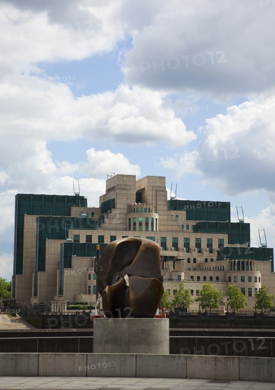 England, London, MI6 Headquarters on the Albert Embankment in Vauxhall seen from Millbank with a Henry Moore bronze Locking Piece sculpture in the foreground. 
Photo : Stephen Rafferty