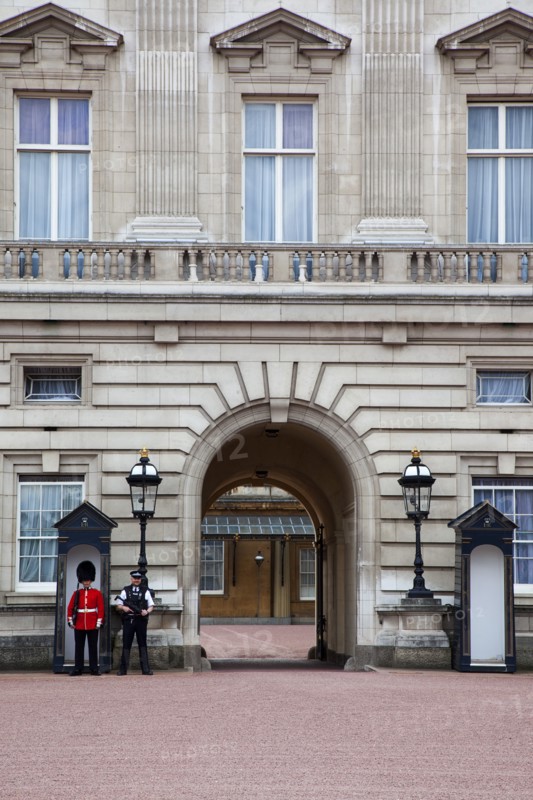 England, London, Westminster Buckingham Palace exterior with both Queens Guard and Metropolitan Police armed officers. 
Photo : Stephen Rafferty