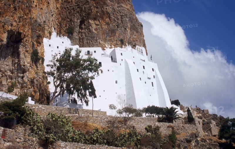Greece, Aegean Islands, Amorgos, Moni Chozoviotissa. Exterior of white painted Byzantine monastery built above terraces on side of steep cliff. 
Photo : Mike Southern