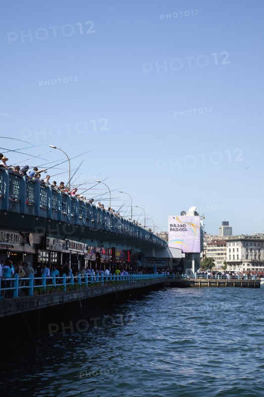 Turkey, Istanbul, Galata Bridge people fishing. 
Photo : Stephen Rafferty