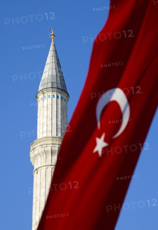 Turkey, Istanbul, Sultanahmet Haghia Sophia minaret and Turkish red flag with white crescent moon and star. 
Photo : Paul Seheult