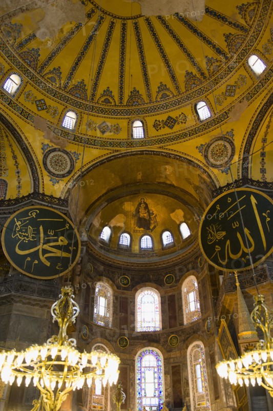 Turkey, Istanbul, Sultanahmet Haghia Sophia Christian murals and Muslim iconography in calligraphic roundels together in the domed interior. 
Photo : Paul Seheult