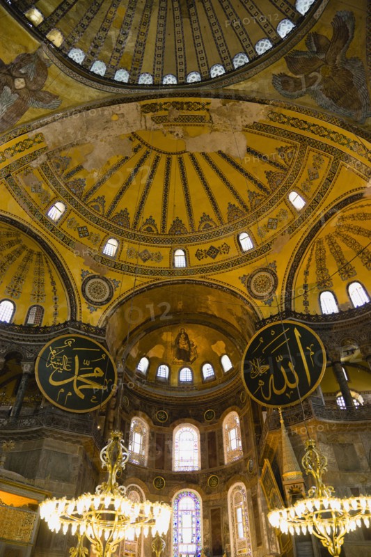 Turkey, Istanbul, Sultanahmet Haghia Sophia Christian murals and Muslim iconography in calligraphic roundels together in the domed interior. 
Photo : Paul Seheult