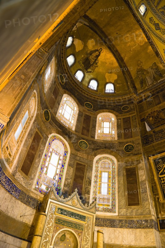 Turkey, Istanbul, Sultanahmet Haghia Sophia Christian mosaic of Virgin Mary and Infant Jesus and Muslim Mihrab indicating the direction of Mecca in a niche at the end of the nave. 
Photo : Paul Seheult