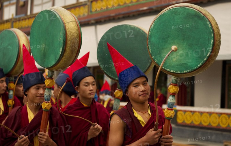 Buddhist Monks playing drums in a Losar ceremony, Sikkim, India