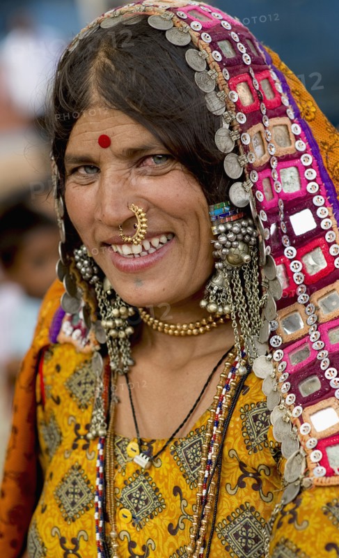 PORTRAIT OF A LAMBANI GYPSY TRIBAL WOMAN WITH TRADITIONAL TRIBAL JEWELRY AND COSTUME, INDIA. (MR)