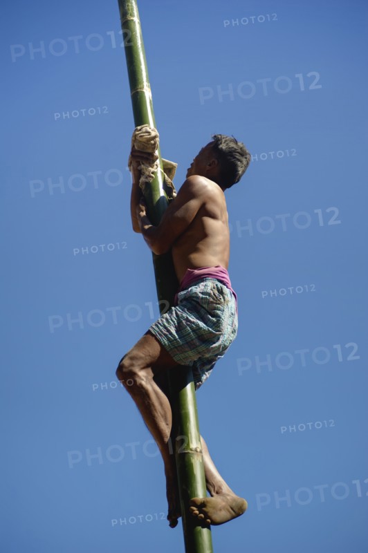 BAMBOO POLE CLIMBING, NAGA WARRIOR TRIBE, NAGALAND, NORTH EAST INDIA