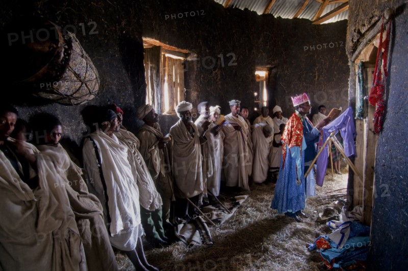 Ethiopia, Religion, Christianity, Service inside rural mud built rural Christian church. 
Photo : Adrian Arbib