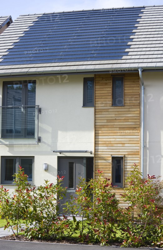 Architecture, Environment, Solar Power, Alternative Energy Electricity Solar photovoltaic roof tiles or slates on new houses by Linden Homes in Graylingwell Park. 
Photo : Paul Seheult