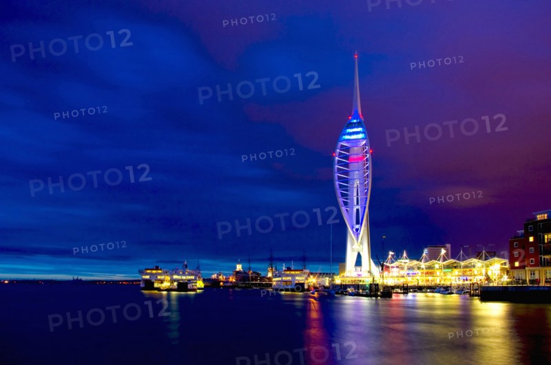England, Hampshire, Portsmouth, Spinnaker Tower and Gunwharf Quays illuminated at night. 
Photo : Chris Penn
