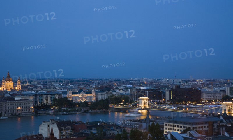 Buda Castle District view over Danube and Pest with St Stephen's Basilica illuminated.