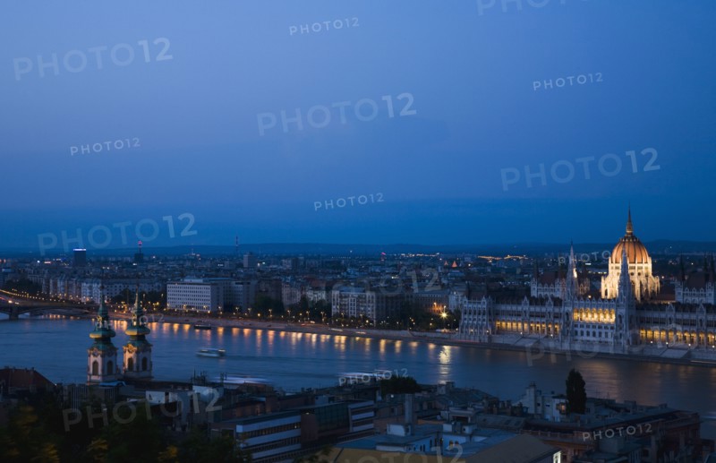 Buda Castle District view over Danube and Pest with Parliament Building illuminated.