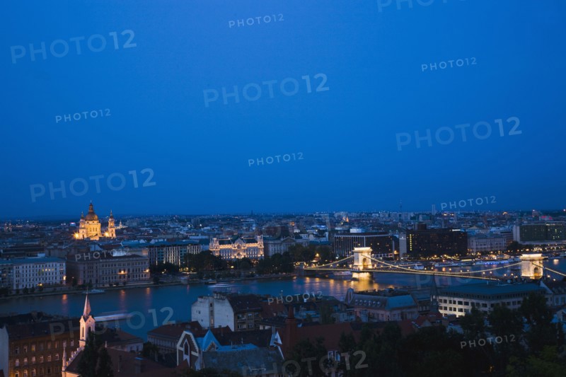 Buda Castle District view over Danube and Pest with St Stephen's Basilica illuminated.