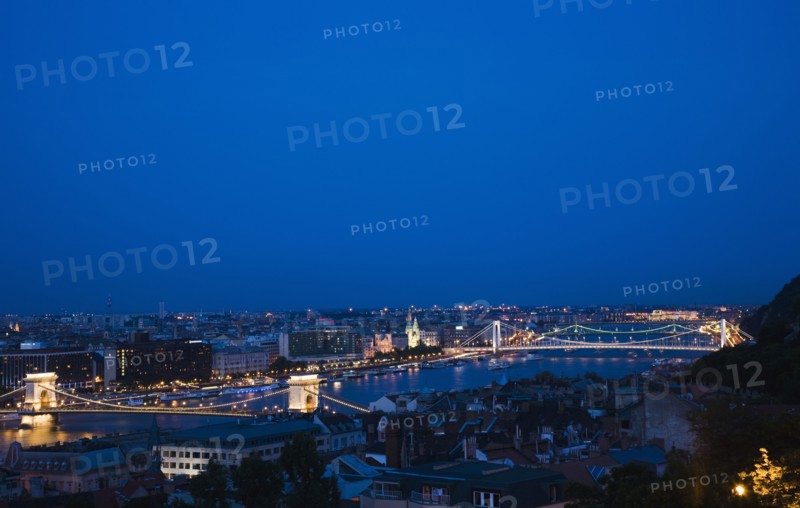 Buda Castle District: view over Danube and Pest with Memorial Chain Bridge illuminated.