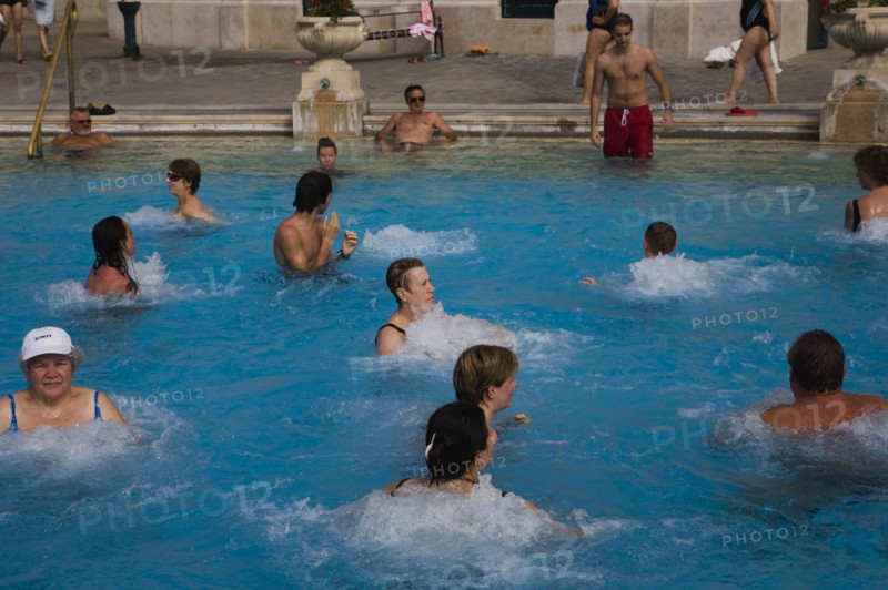 Pest Mixed group outdoor bathing in summer at Szechenyi thermal baths largest in Europe.