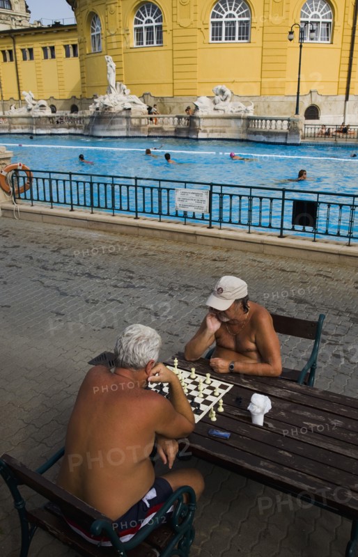 Pest Bathers playing chess in summer at Szechenyi thermal baths largest in Europe.