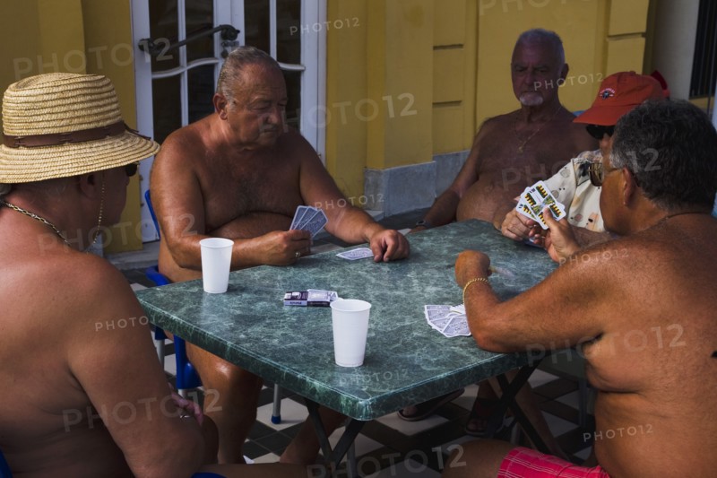 Pest Male bathers playing cards in summer at Szechenyi thermal baths largest in Europe.