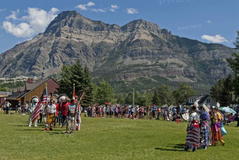 Pow Wow Grand Entry at the Blackfoot Arts & Heritage Festival to celebrate Parks Canada's centennial Flags of Canada and the United States