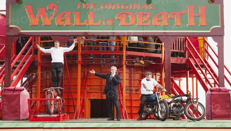 Wall of death motorcycle fairground attraction on Madeira Drive during motorbike festival.