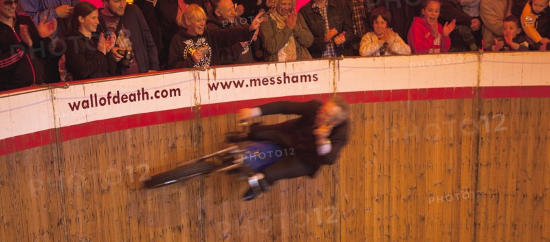 Wall of death motorcycle fairground attraction on Madeira Drive during motorbike festival.