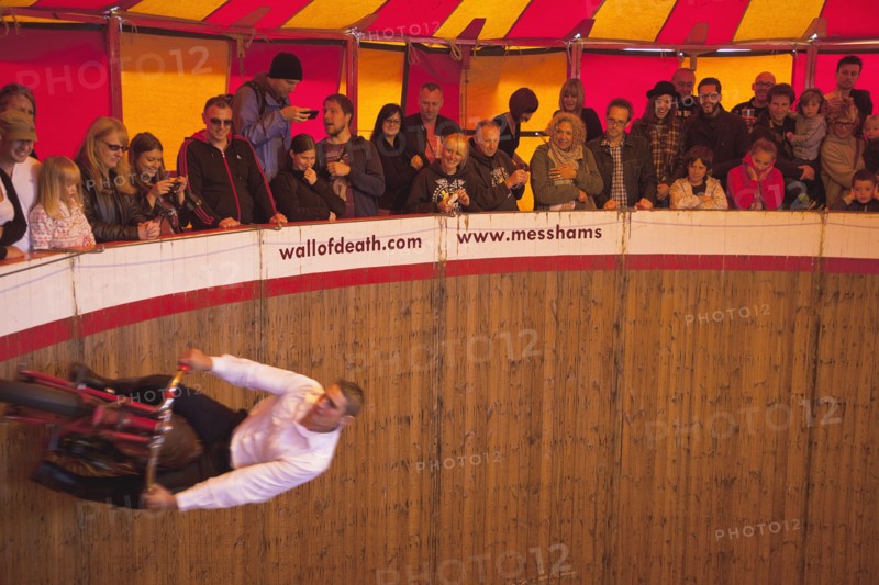 Wall of death motorcycle fairground attraction on Madeira Drive during motorbike festival.