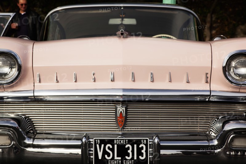 Old American Oldsmobile on Madeira Drive during classic car festival.