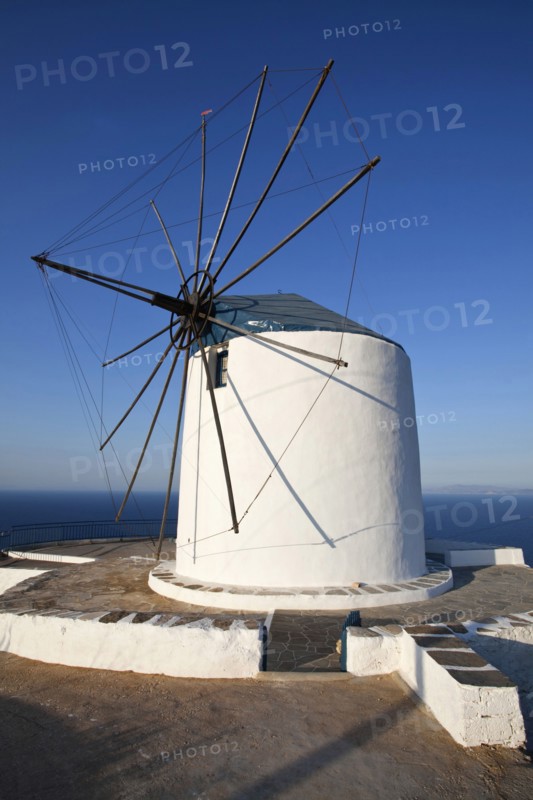 Old wind mill which is now converted to accomodation on the top of a cliff.