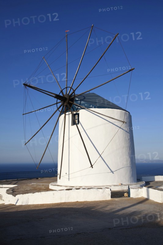 Old wind mill which is now converted to accomodation on the top of a cliff.
