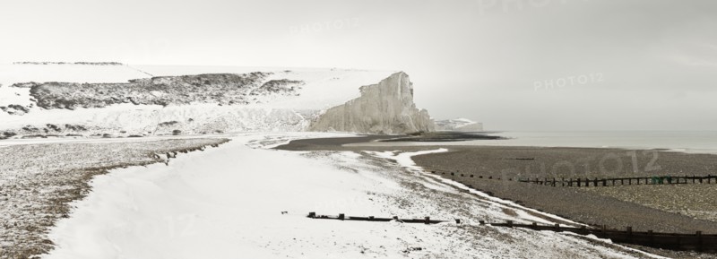 Seven Sisters Snow covered chalk cliffs viewed from the coastguard cottages at Cuckmere Haven.
