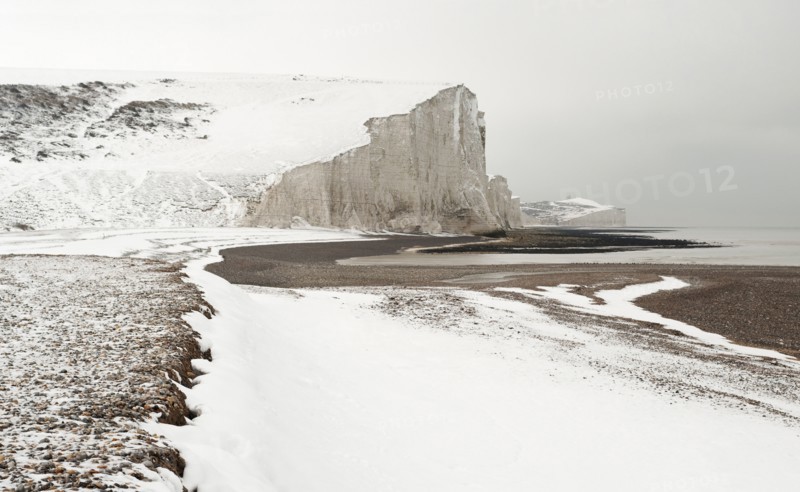 Seven Sisters Snow covered chalk cliffs viewed from the coastguard cottages at Cuckmere Haven.