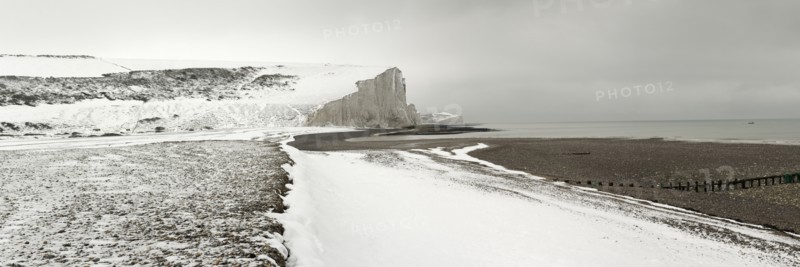 Seven Sisters Snow covered chalk cliffs viewed from the coastguard cottages at Cuckmere Haven.