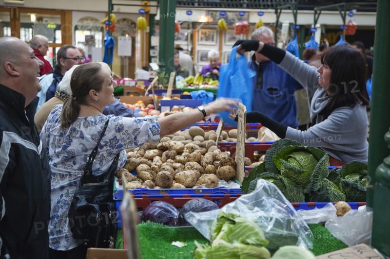 St Georges Market Veg stall selling potatoes and cabbage.