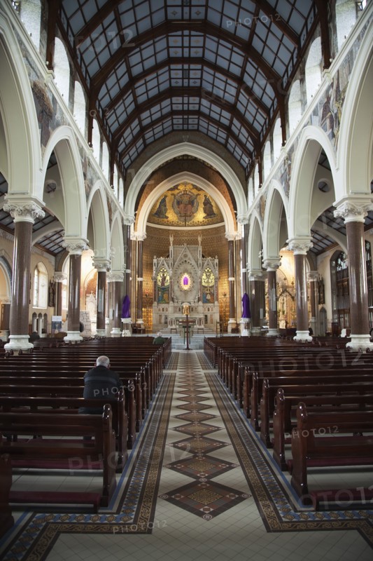Falls Road Clonard Monastery interior decorated for Good Friday with statues draped in purple cloth.