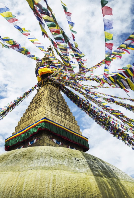 Boudhanath Stupa near Kathmandu, with coloutful prayer flags.